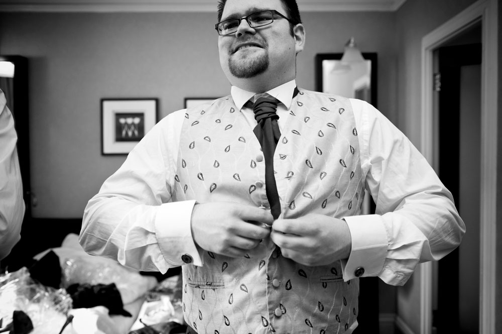 Groom getting dressed