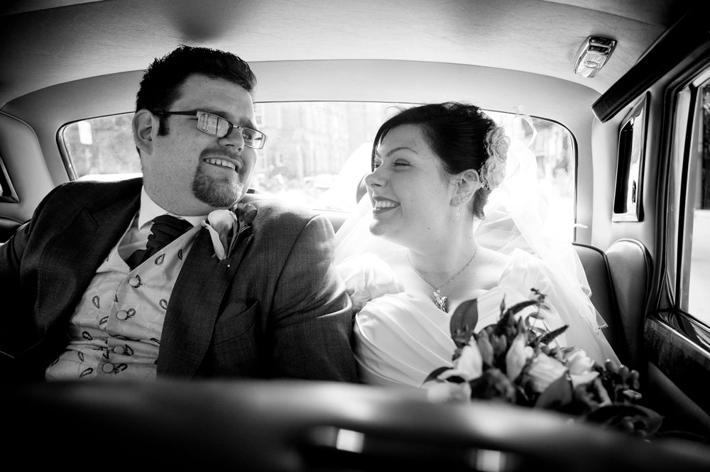 Couple just married sat in back of car