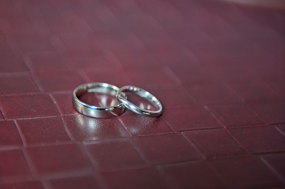 Wedding bands on leather chair