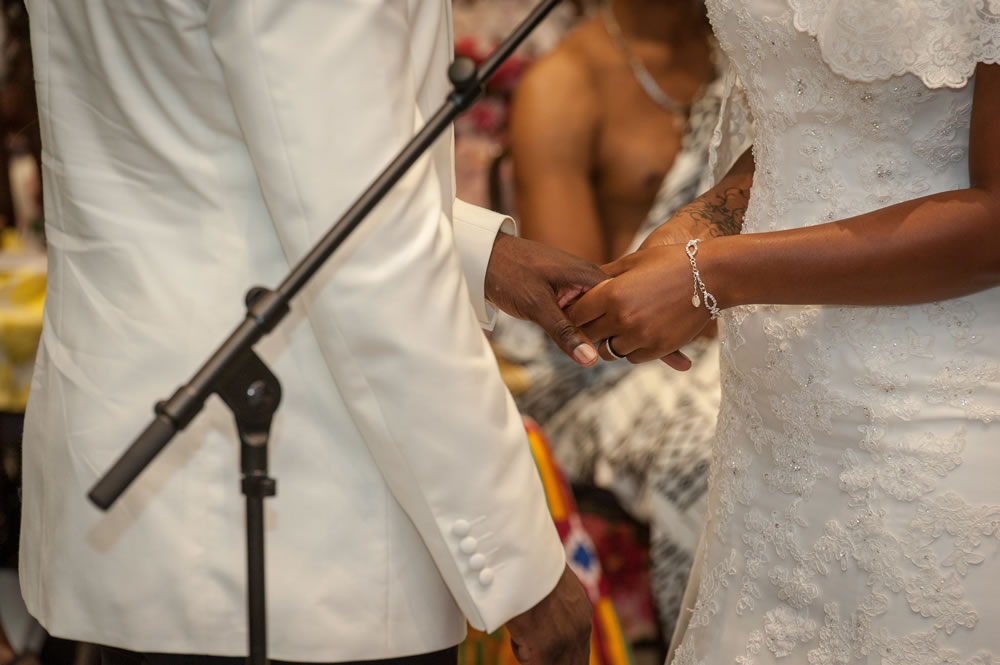 Couple holding hands during service