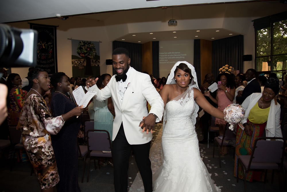 Couple dancing out of church