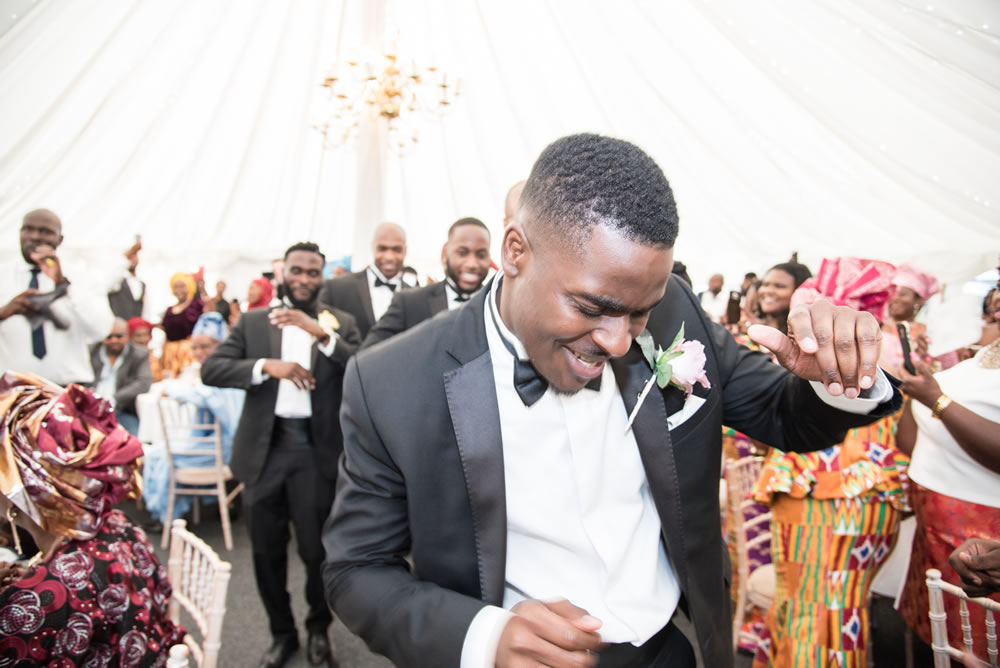 Best man dancing into reception
