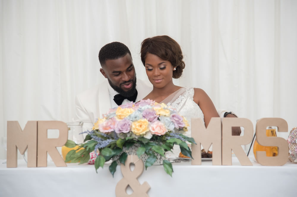 Couple sitting together at top table