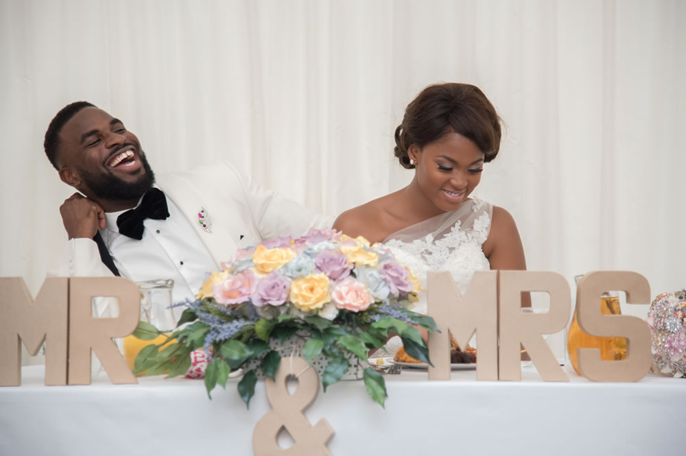 Groom laughing during speeches
