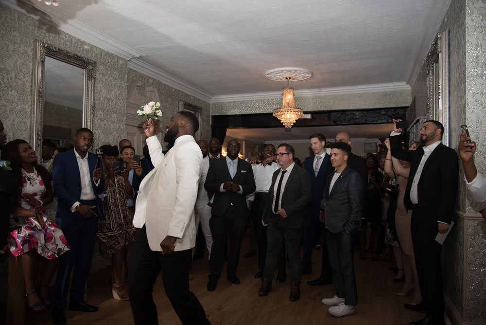 Groom tossing the bouquet