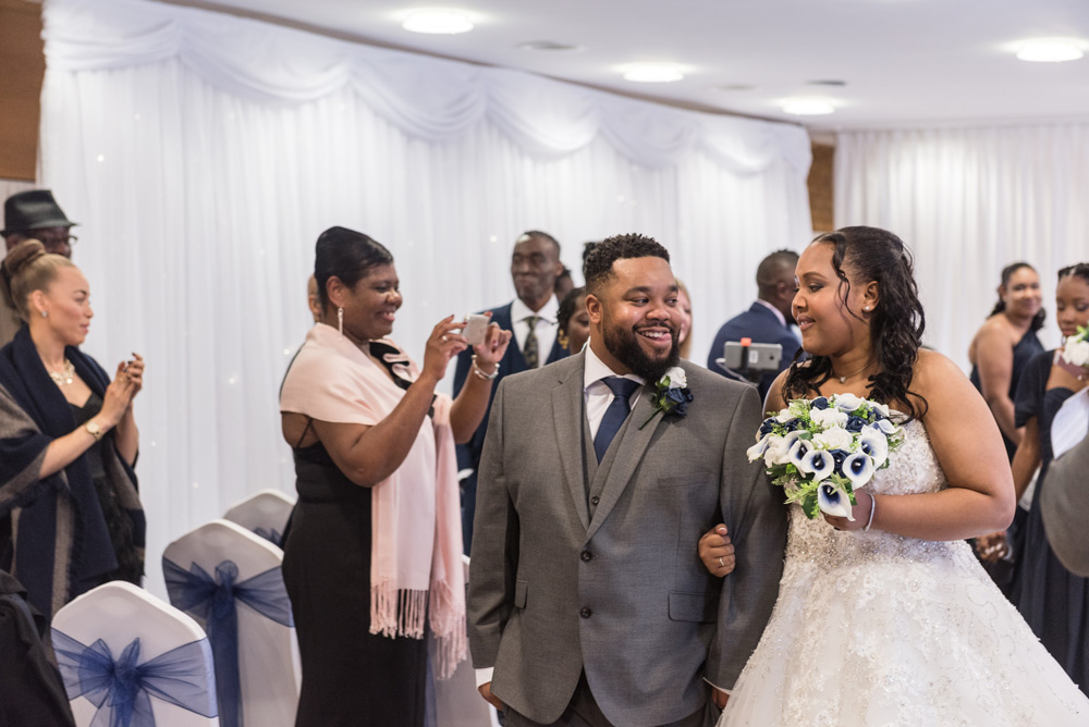 Couple leaving ceremony room