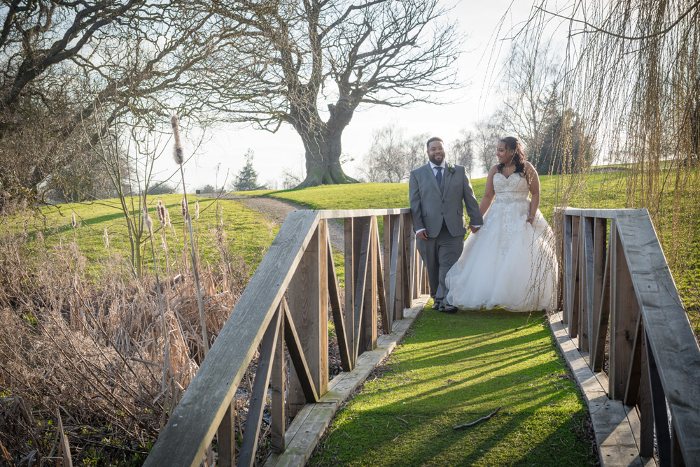 Couple walking over bridge