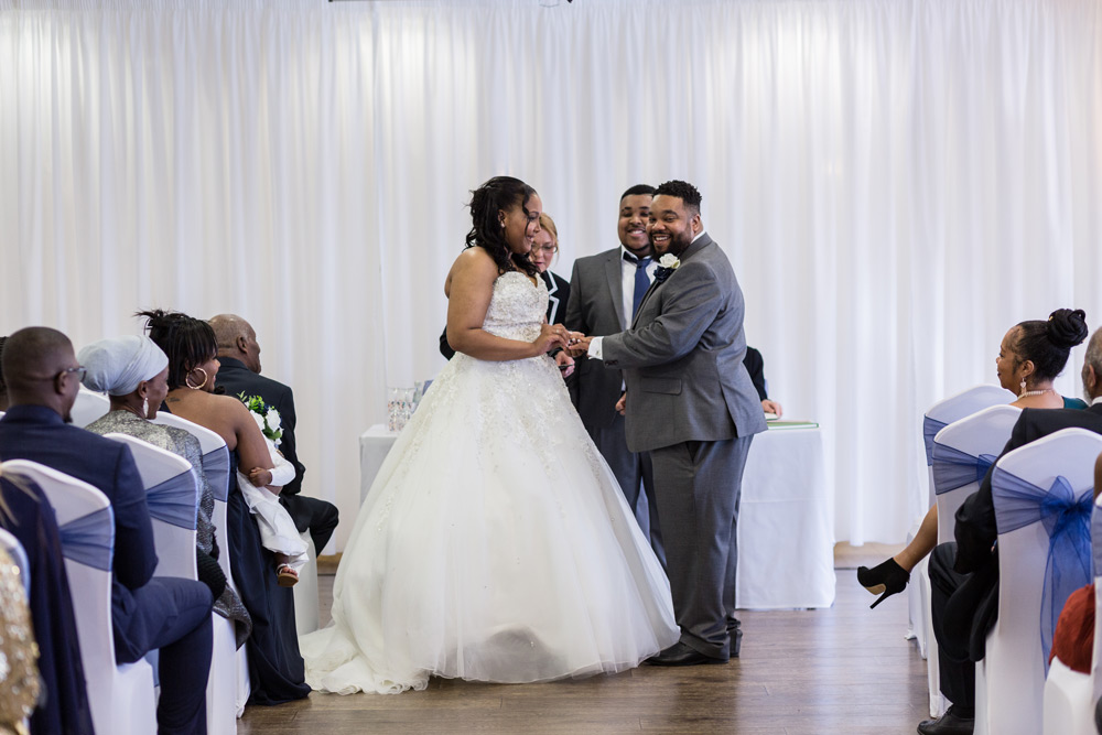 Putting ring on groom